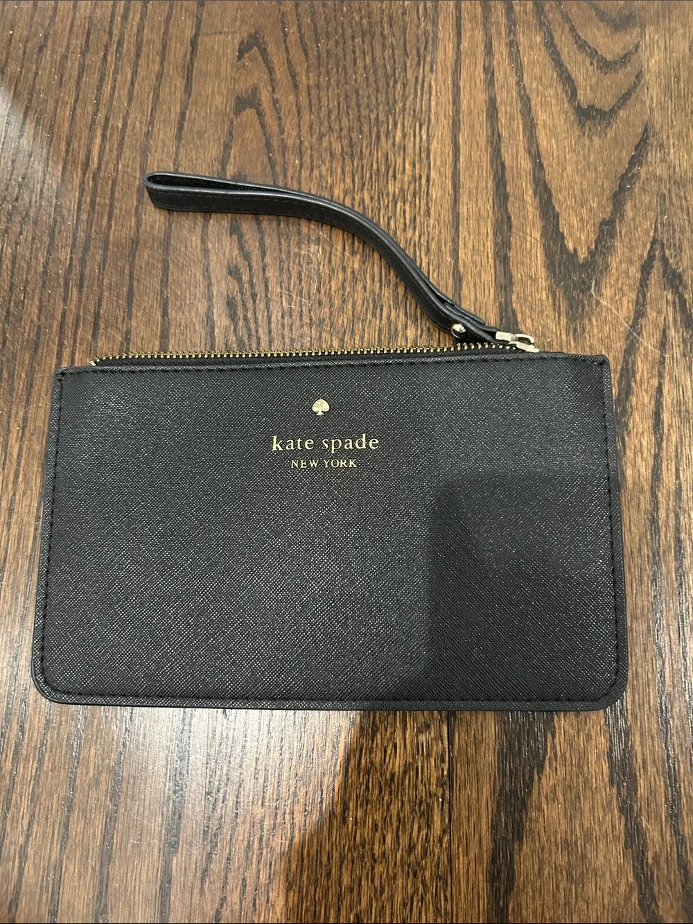 kate spade black and gold wristlet pouch